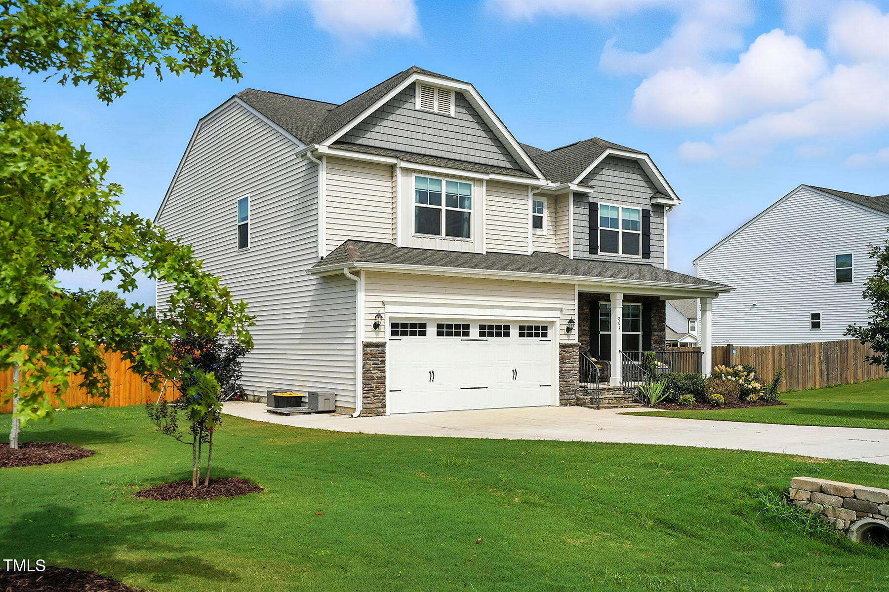801 Mdw Frd Way Willow Spring, NC 27592 - Photo 3 of 36 a front view of a house with a yard