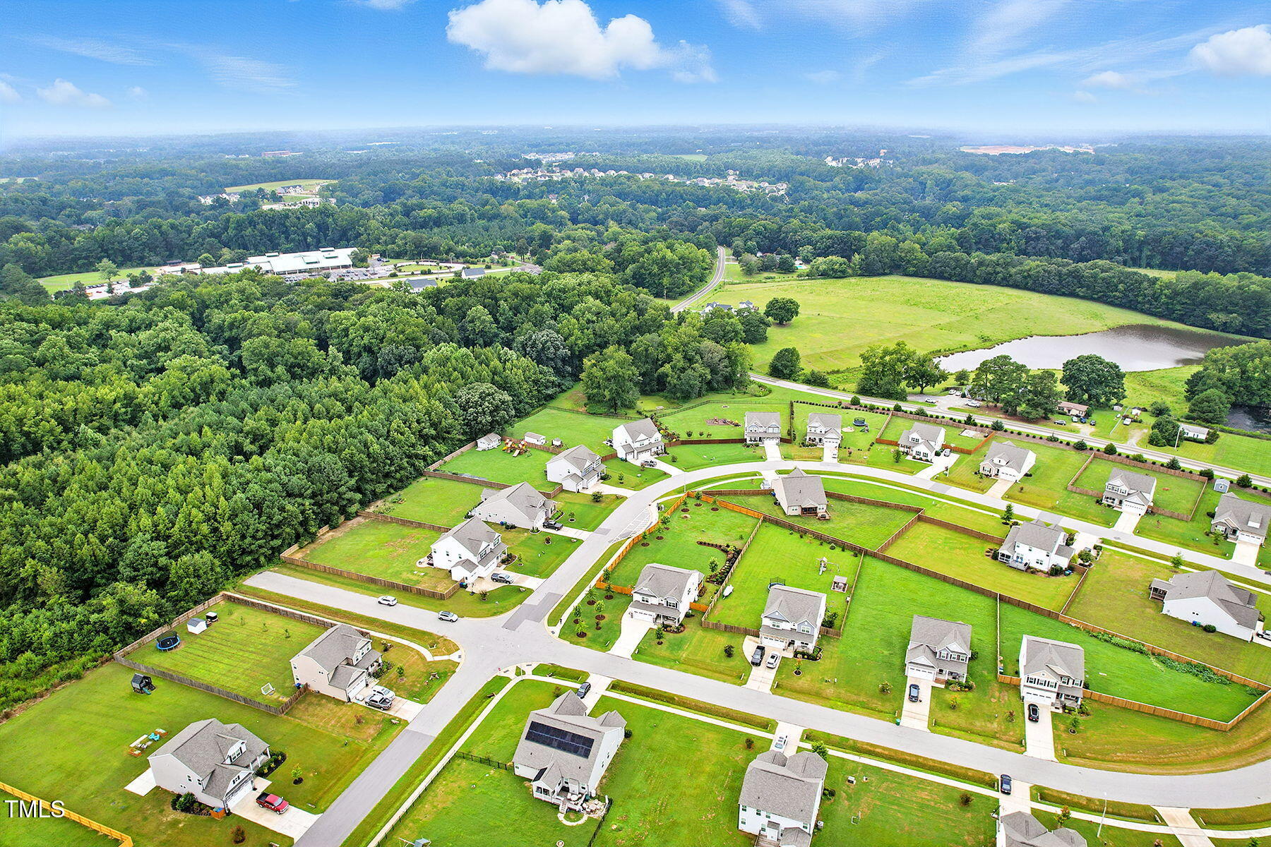 801 Mdw Frd Way Willow Spring, NC 27592 - Photo 34 of 36 an aerial view of a pool patio swimming pool and outdoor seating