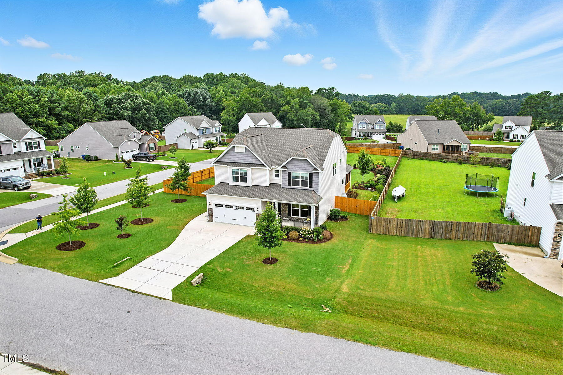 801 Mdw Frd Way Willow Spring, NC 27592 - Photo 4 of 36 an aerial view of a houses with a big yard