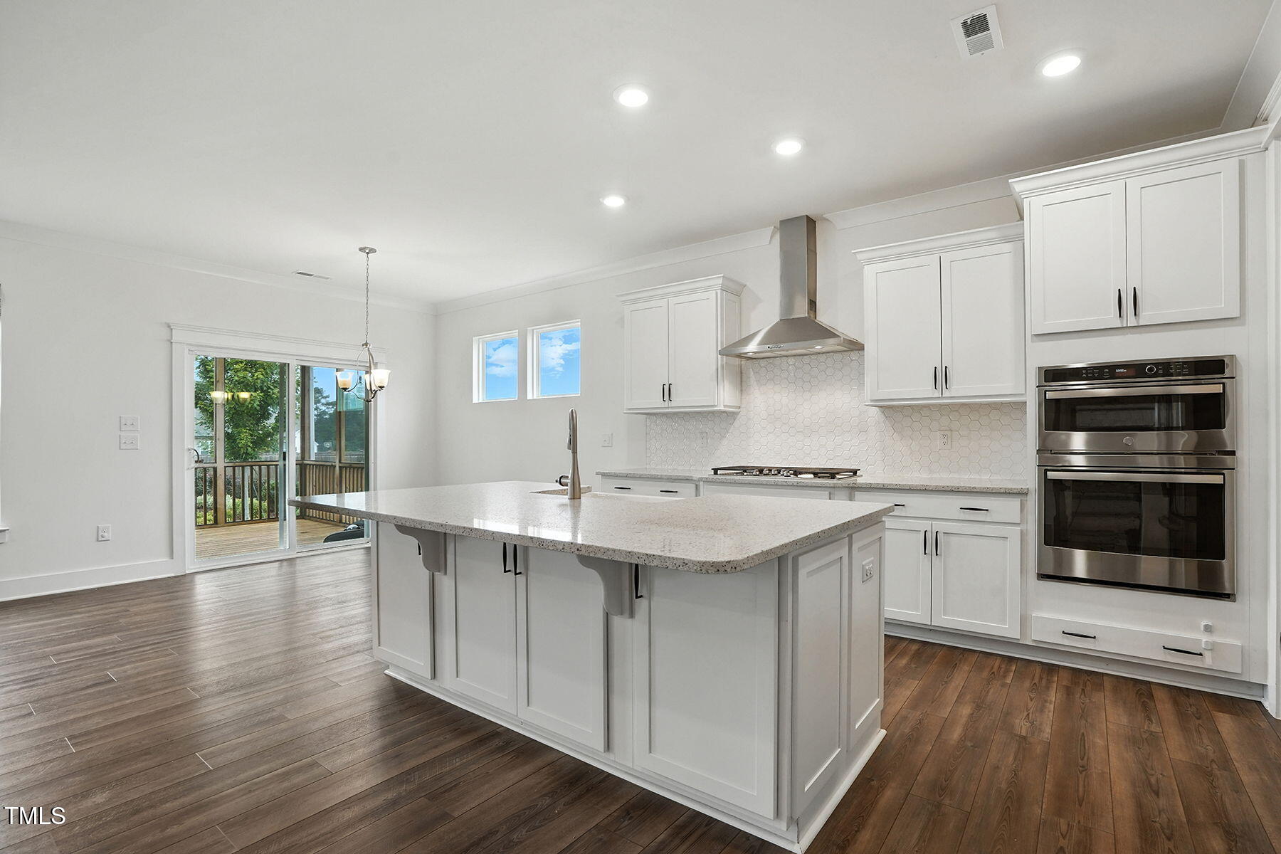 801 Mdw Frd Way Willow Spring, NC 27592 - Photo 6 of 36 a kitchen with stainless steel appliances granite countertop a sink stove and refrigerator