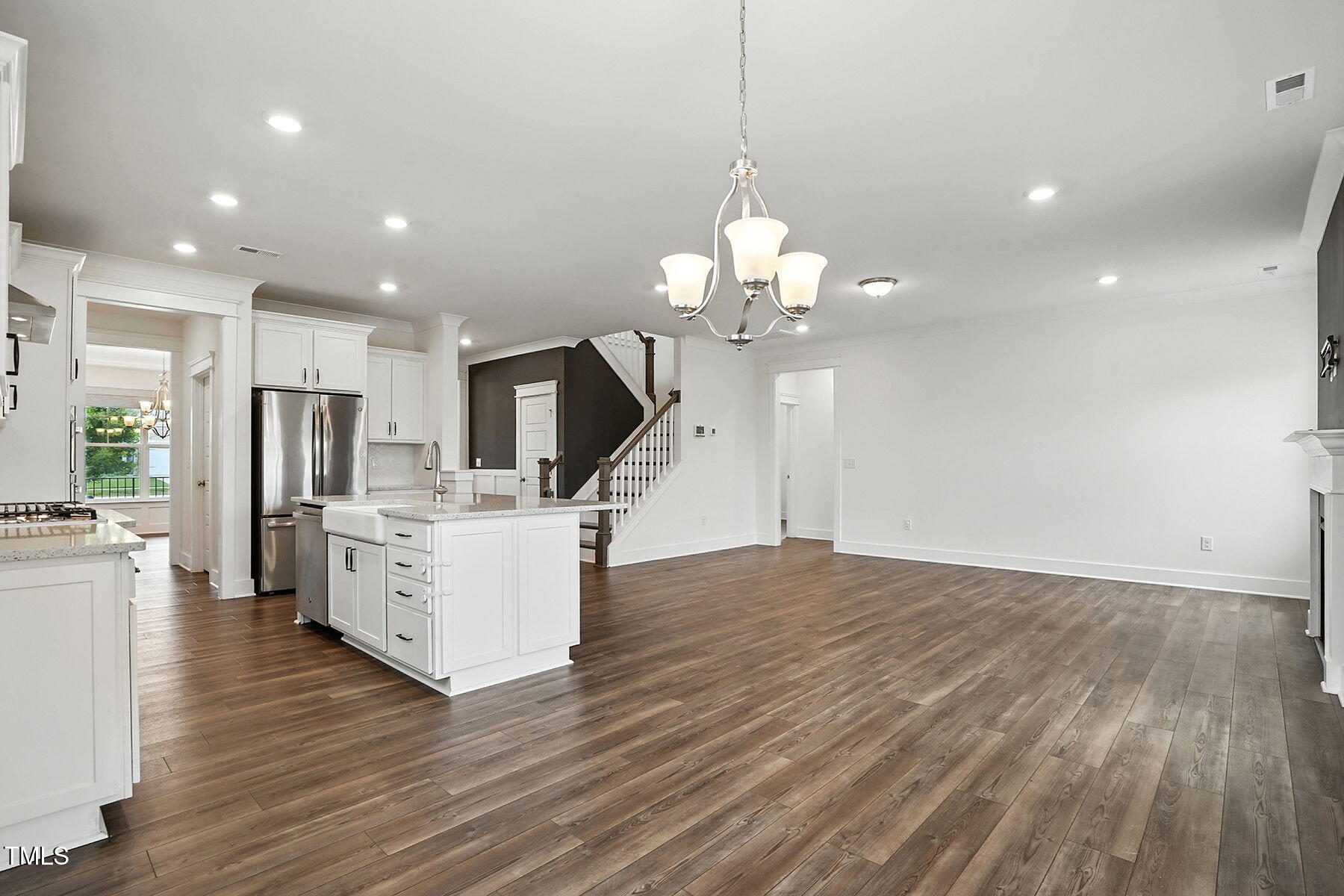 801 Mdw Frd Way Willow Spring, NC 27592 - Photo 8 of 36 a view of kitchen with refrigerator microwave and wooden floor