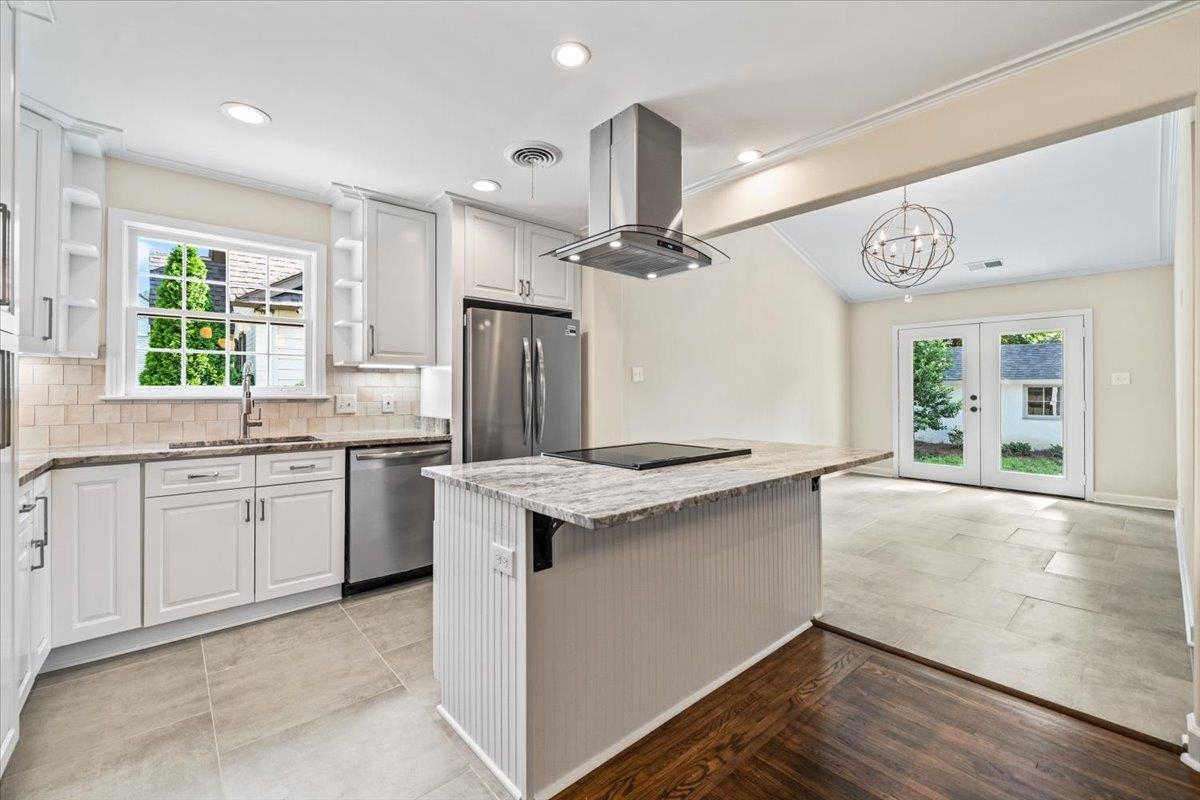 170 South Greer Street Memphis, TN 38111 - Photo 26 of 35 Modern kitchen featuring white shaker cabinetry, stainless steel appliances, a center island with cooktop, recessed lighting, and tile flooring