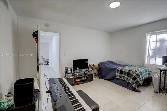 a kitchen with a sink a stove and cabinets