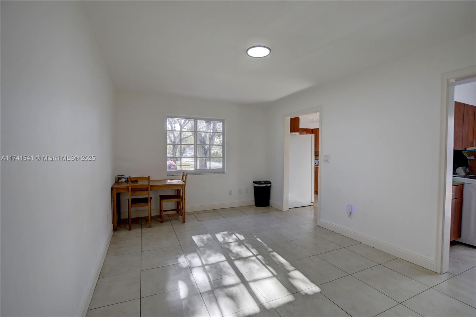 4995 Ponce De Leon Coral Gables, FL 33146 - Photo 35 of 92 an empty room with windows and wooden floor