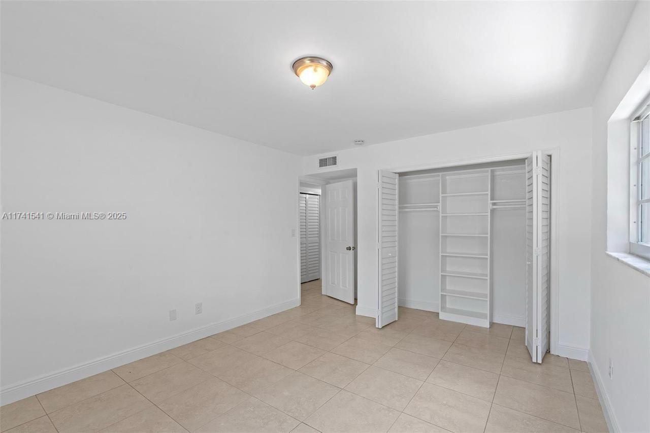 4995 Ponce De Leon Coral Gables, FL 33146 - Photo 40 of 92 an empty room with closet area