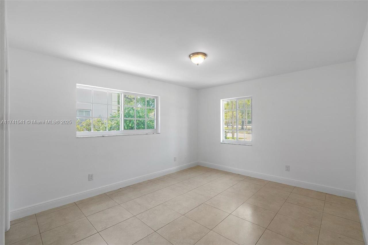 4995 Ponce De Leon Coral Gables, FL 33146 - Photo 43 of 92 an empty room with a window