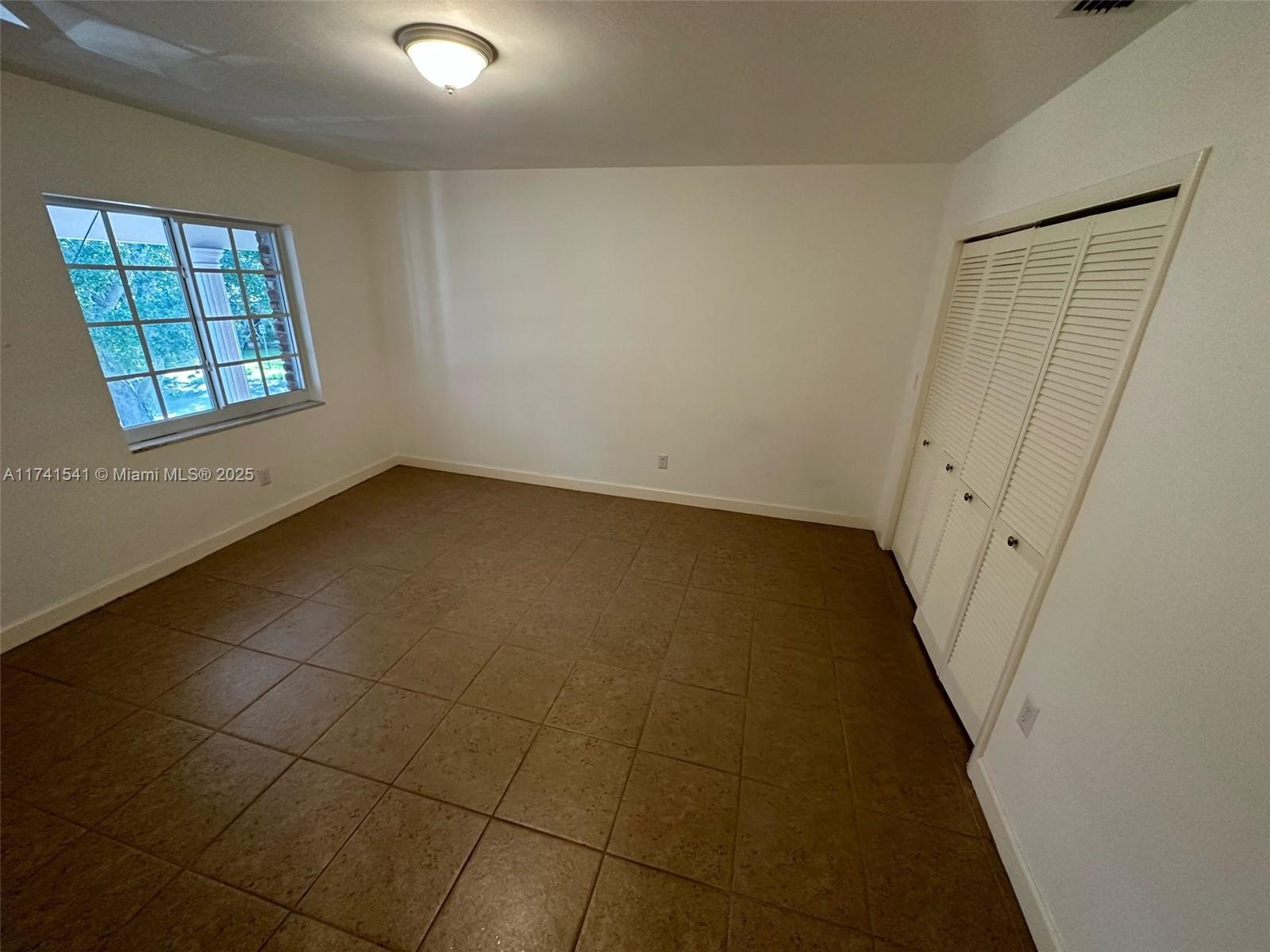 4995 Ponce De Leon Coral Gables, FL 33146 - Photo 57 of 92 an empty room with windows