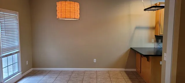 a bathroom with a sink and a window