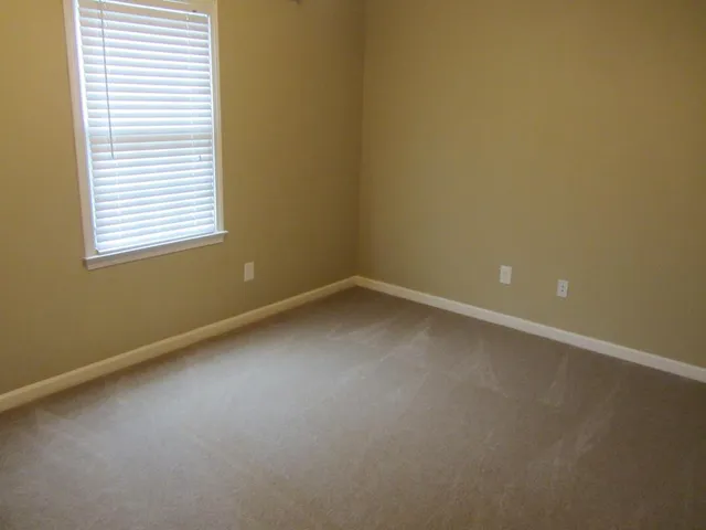 a bathroom with a toilet and shower