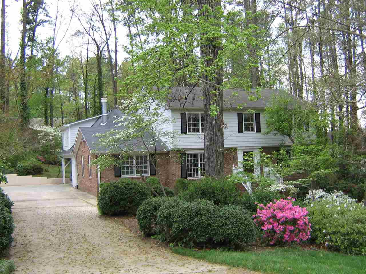 2929 Buckingham Road Durham, NC 27707 - Photo 1 of 26 a front view of a house with a yard and fountain