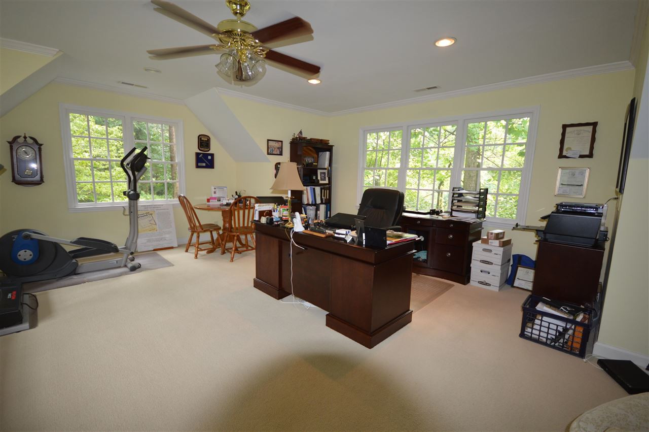 2929 Buckingham Road Durham, NC 27707 - Photo 12 of 26 a living room with furniture large window and flat screen tv
