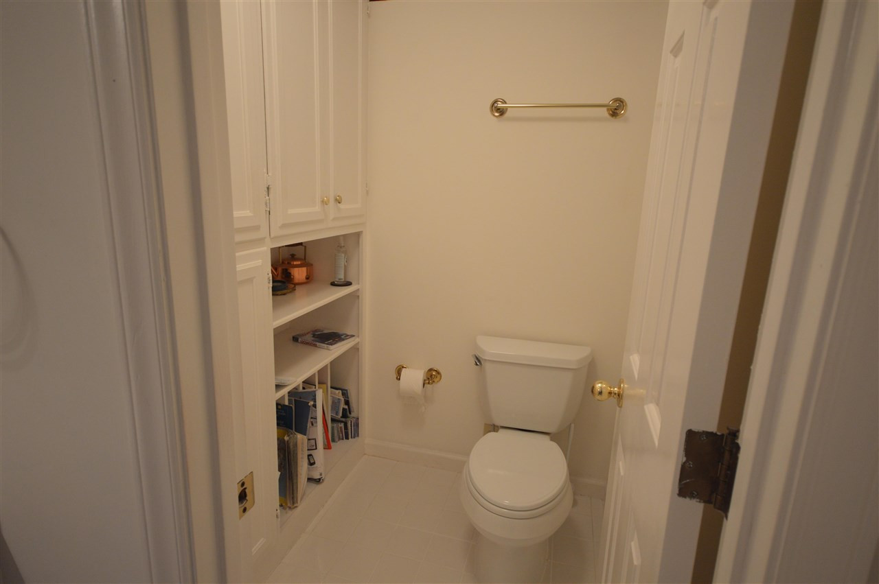2929 Buckingham Road Durham, NC 27707 - Photo 18 of 26 a bathroom with a toilet and a shower