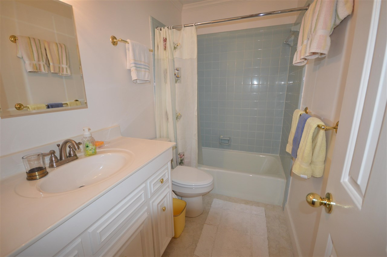 2929 Buckingham Road Durham, NC 27707 - Photo 23 of 26 a bathroom with a sink toilet and shower