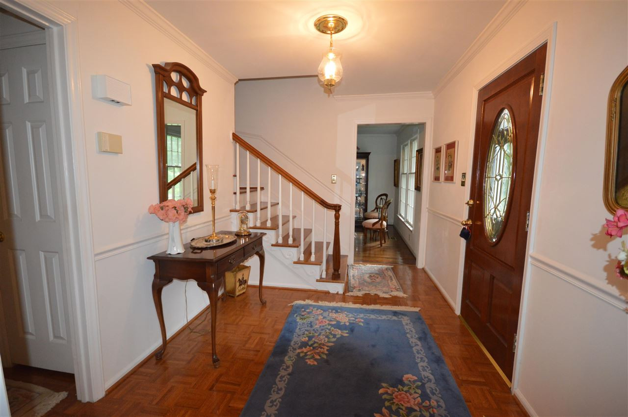 2929 Buckingham Road Durham, NC 27707 - Photo 3 of 26 a view of entryway and hall with wooden floor