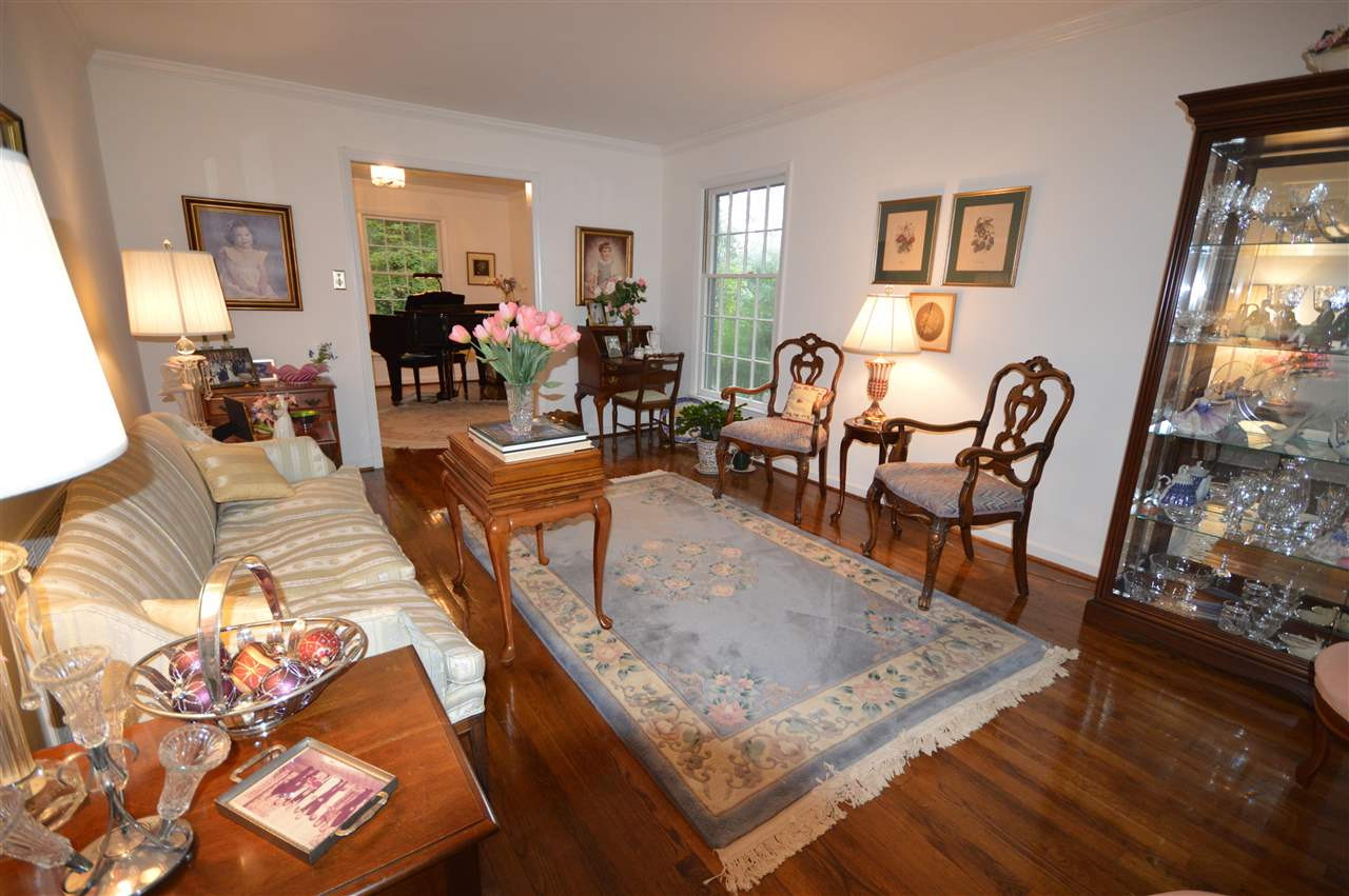 2929 Buckingham Road Durham, NC 27707 - Photo 4 of 26 a living room with furniture and a table
