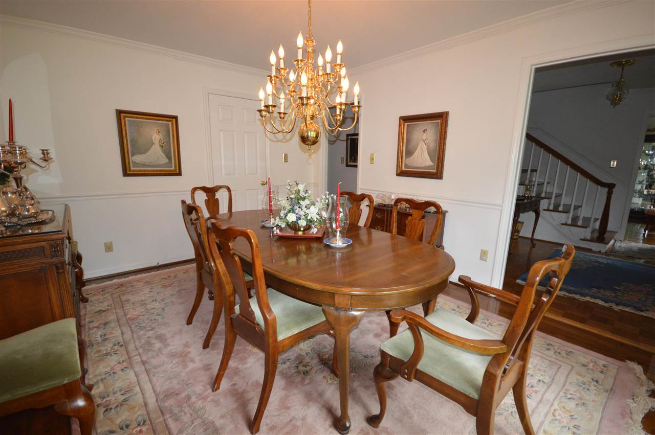 2929 Buckingham Road Durham, NC 27707 - Photo 5 of 26 a dining room with furniture and chandelier