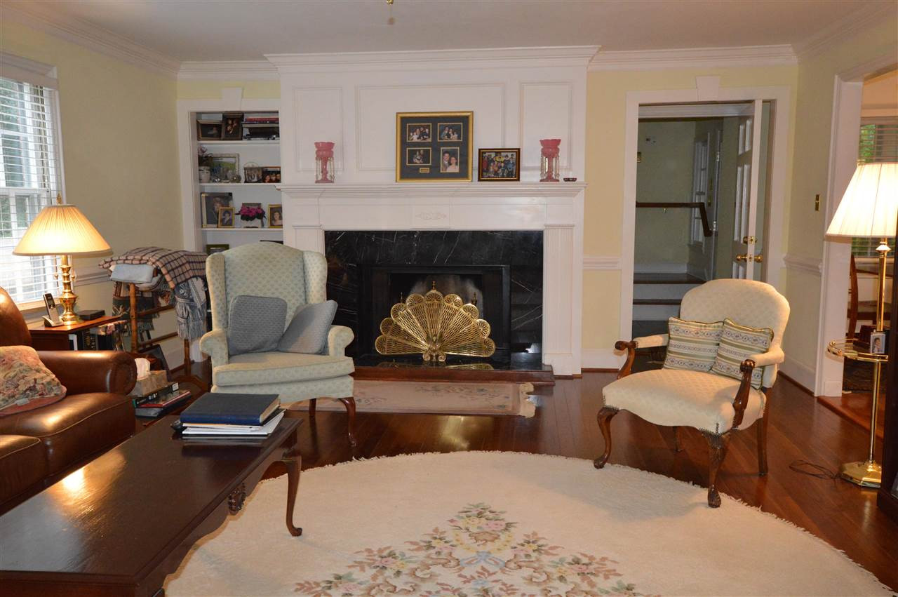2929 Buckingham Road Durham, NC 27707 - Photo 6 of 26 a living room with furniture and a fireplace