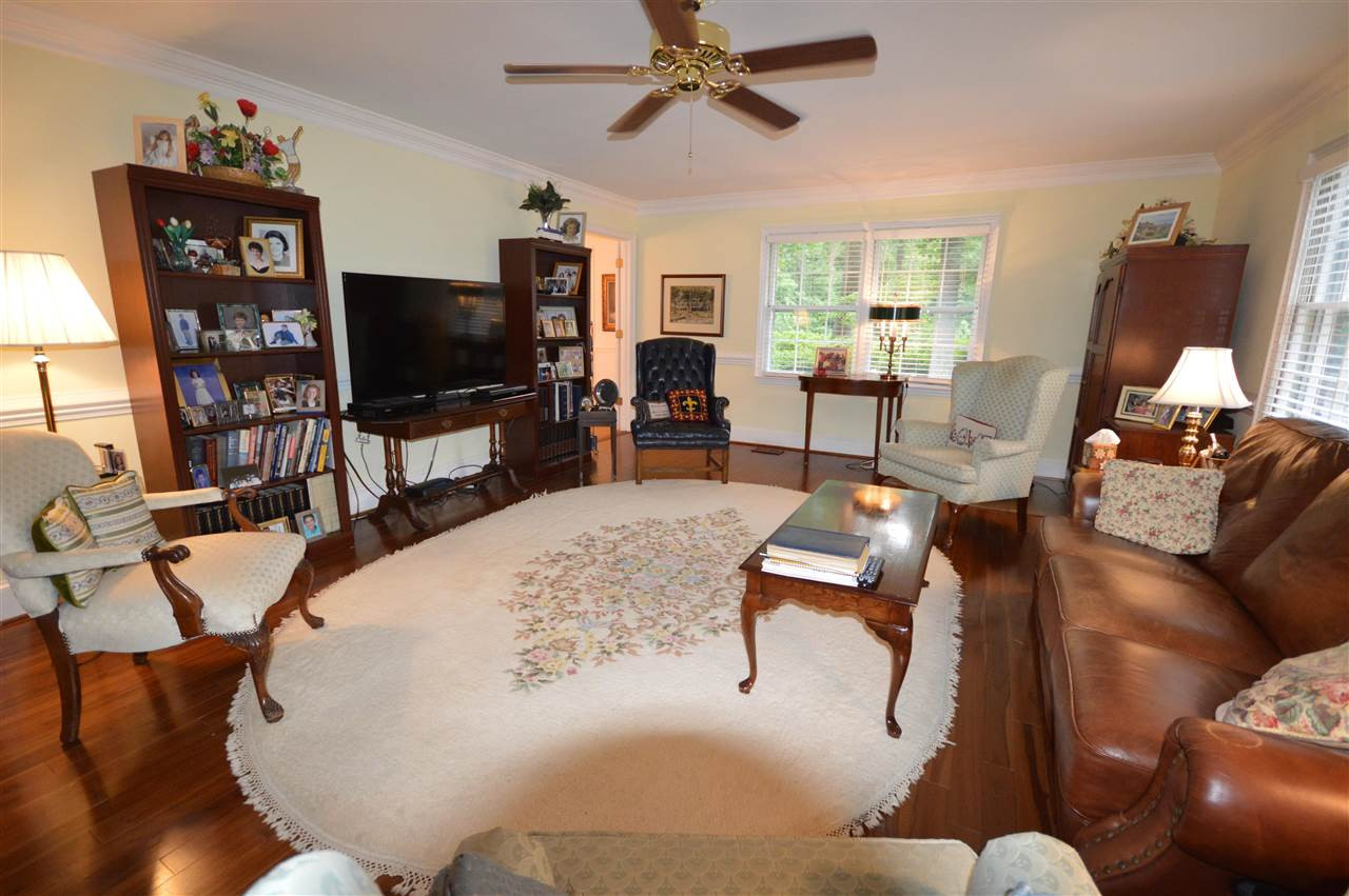 2929 Buckingham Road Durham, NC 27707 - Photo 7 of 26 a living room with furniture and a flat screen tv