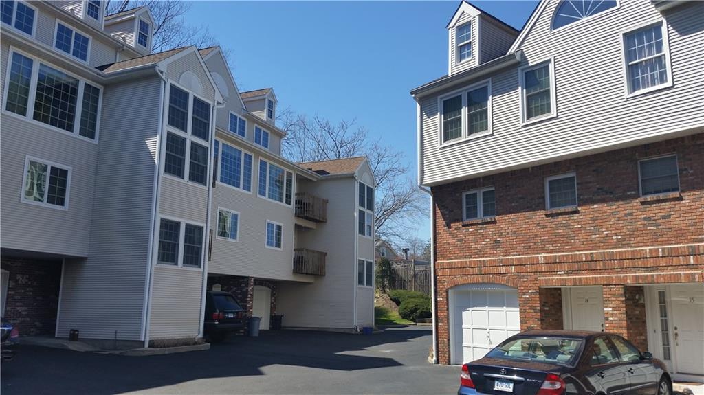 150 Prospect Street, Unit 21 Greenwich, CT 06830 - Photo 1 of 1 a car parked in front of a building
