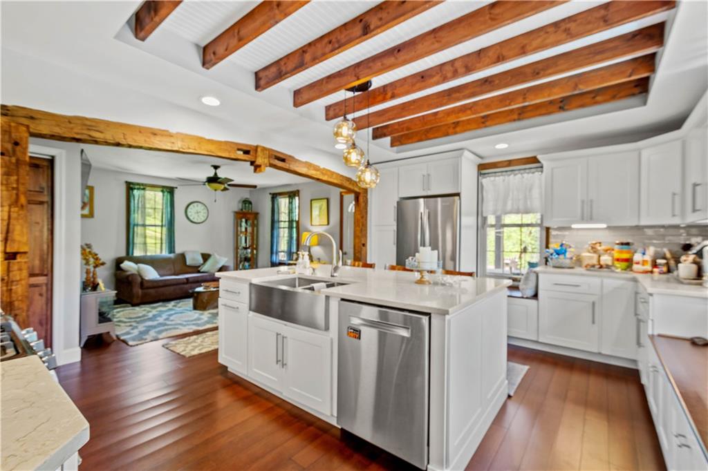 207 Redd Run Road Washington, PA 15301 - Photo 13 of 25 a large white kitchen with cabinets and wooden floor