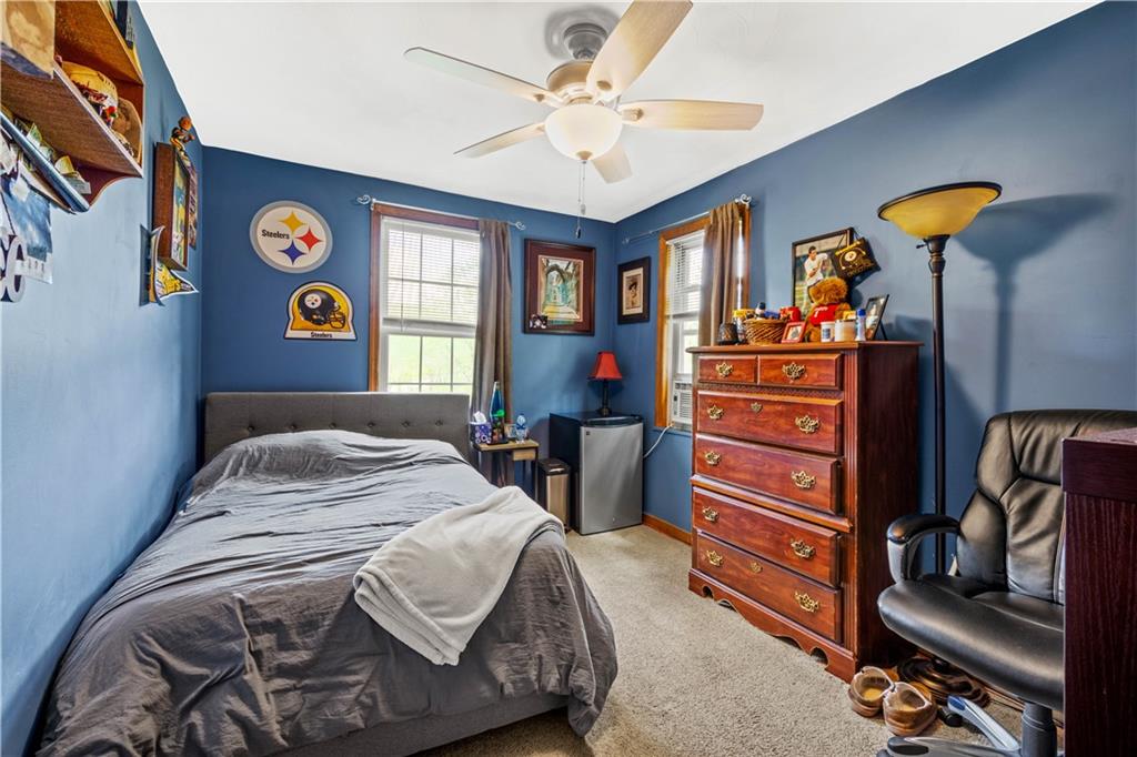 207 Redd Run Road Washington, PA 15301 - Photo 20 of 25 a bedroom with a bed and a chandelier