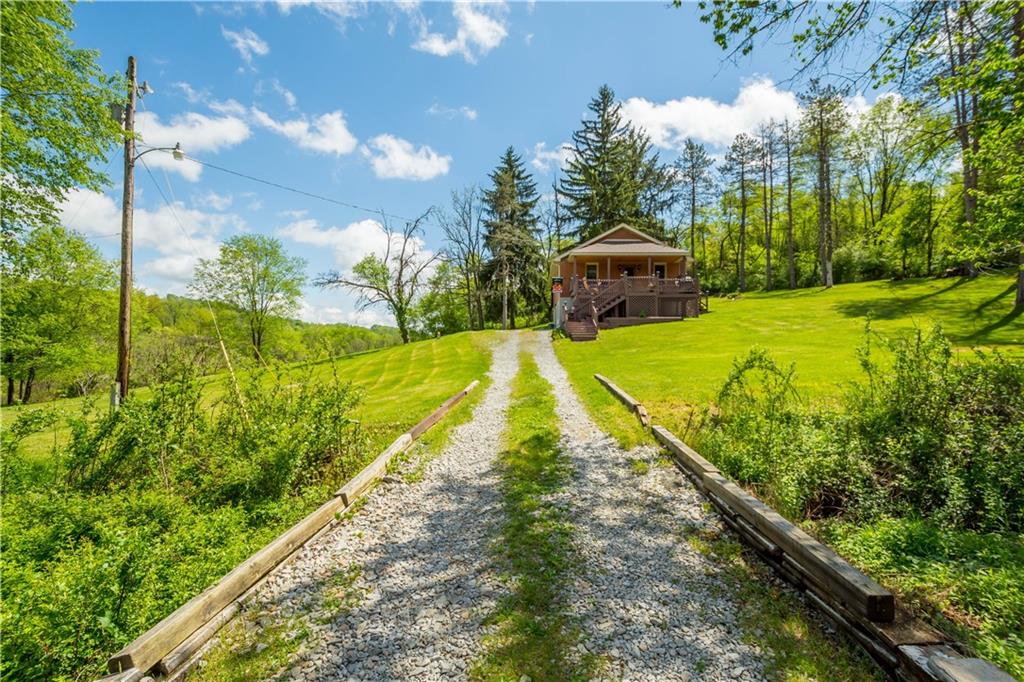 207 Redd Run Road Washington, PA 15301 - Photo 2 of 25 a view of a swimming pool with a garden