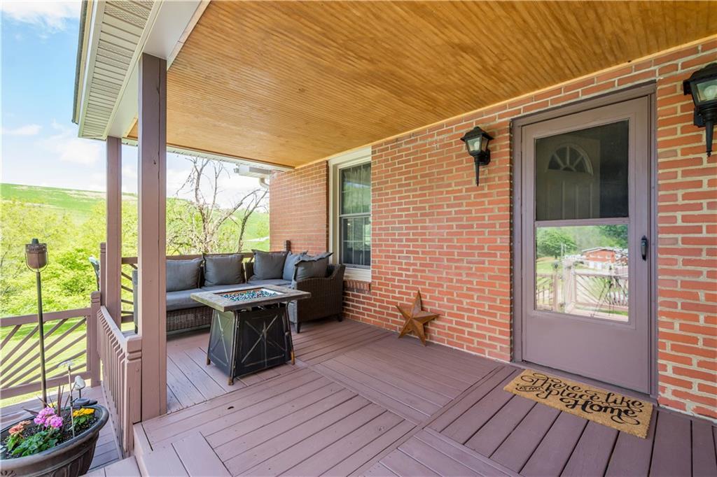 207 Redd Run Road Washington, PA 15301 - Photo 3 of 25 a balcony view with a potted plant and outdoor seating