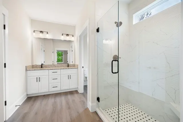 a view of a room with wooden floor