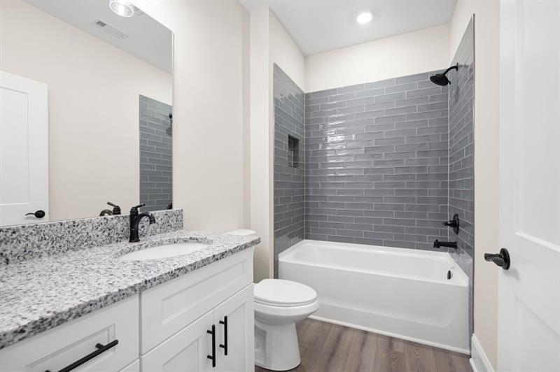 110 Doris Path Temple, GA 30179 - Photo 24 of 35 a bathroom with a granite countertop sink toilet and shower
