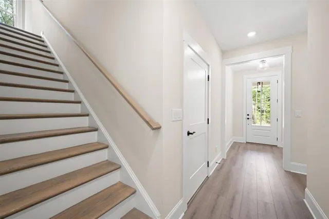a bathroom with a granite countertop toilet a sink and a bathtub