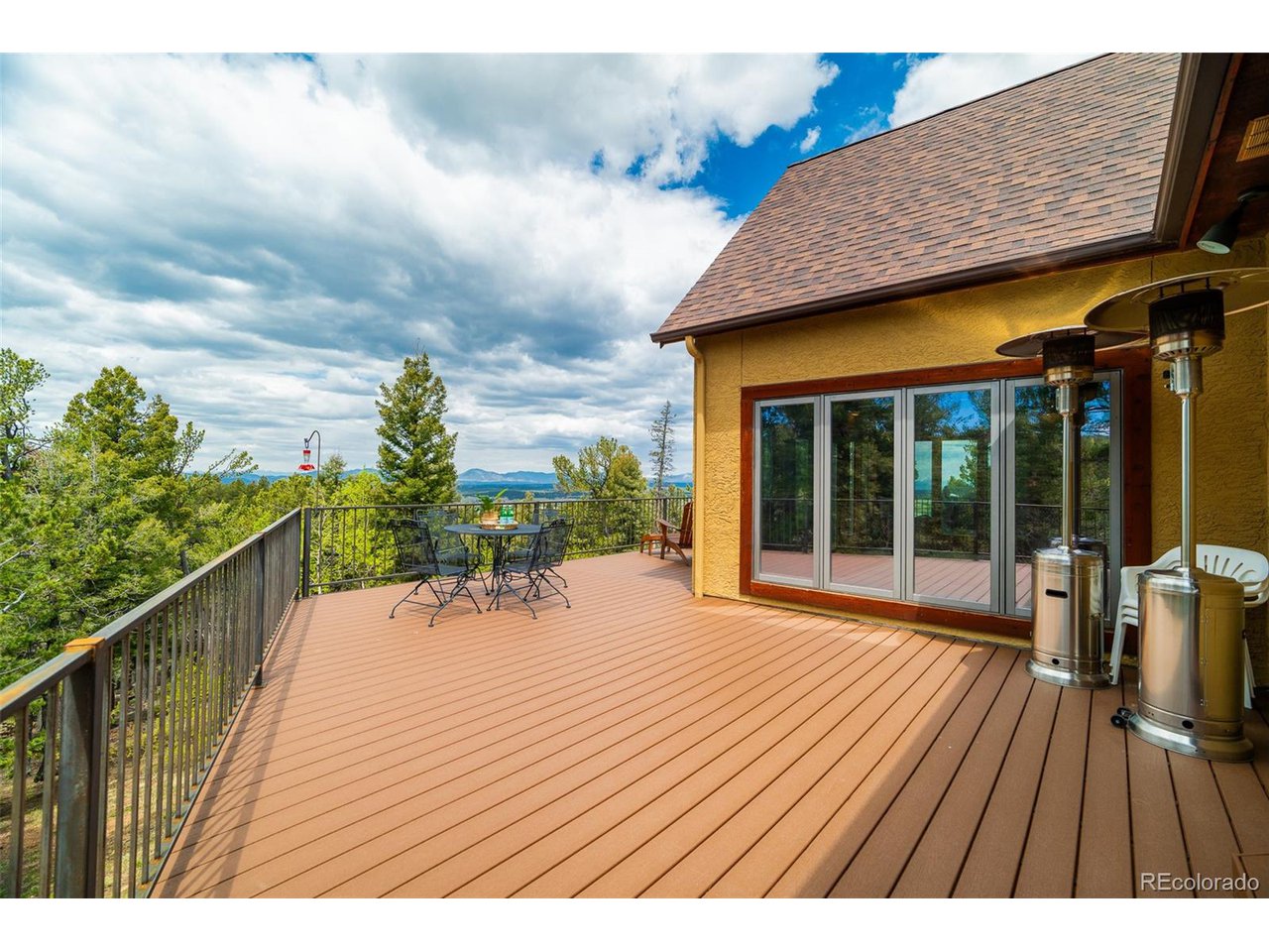 2755 Elk Ridge Divide Divide, CO 80814 - Photo 23 of 50 New composite deck with stunning views of treed hillsides, abundant wildlife, and the Front Range