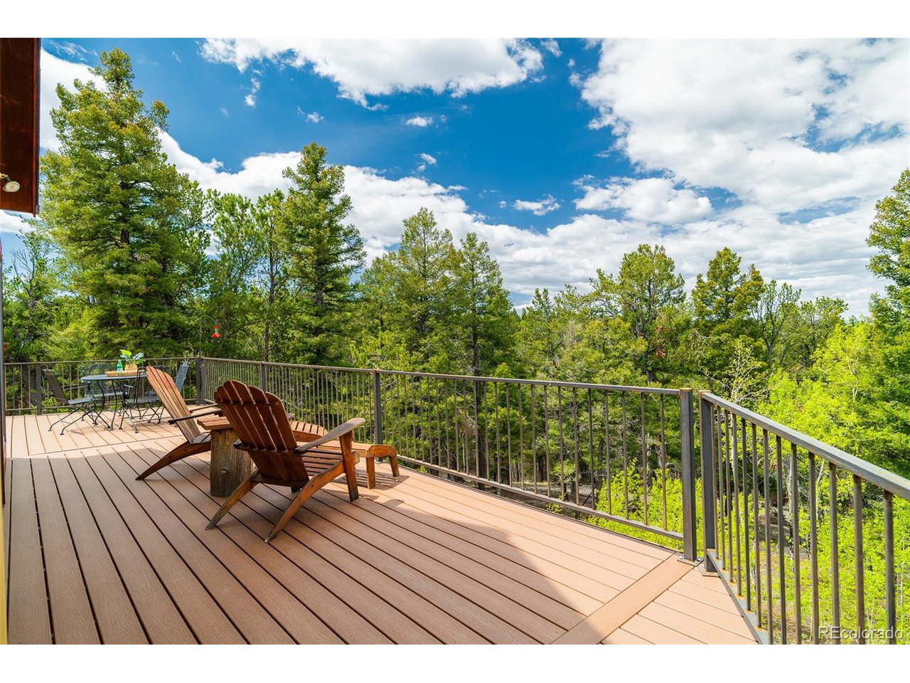 2755 Elk Ridge Divide Divide, CO 80814 - Photo 24 of 50 New composite deck with stunning views of treed hillsides, abundant wildlife, and the Front Range