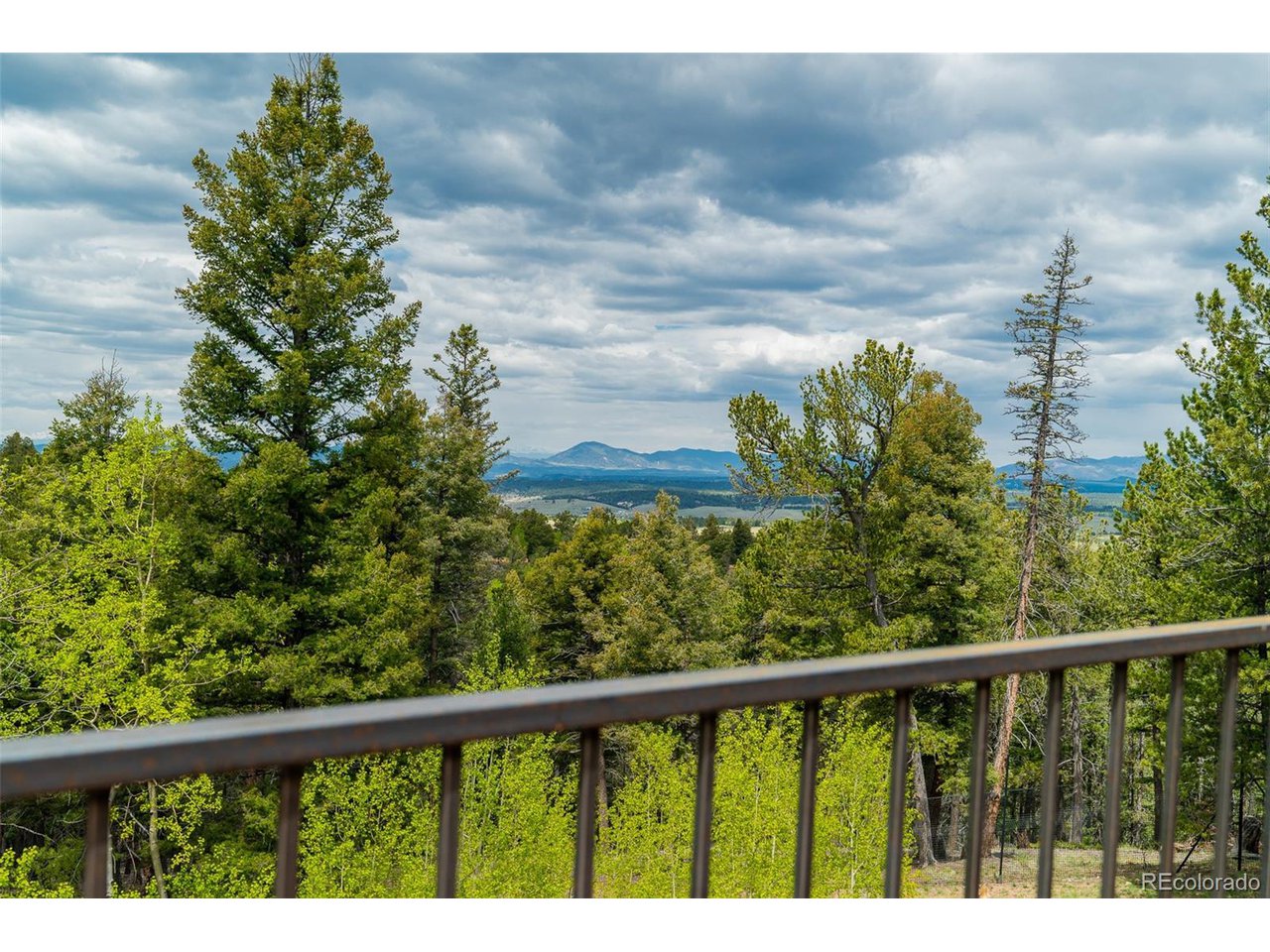 2755 Elk Ridge Divide Divide, CO 80814 - Photo 26 of 50 New composite deck with stunning views of treed hillsides, abundant wildlife, and the Front Range