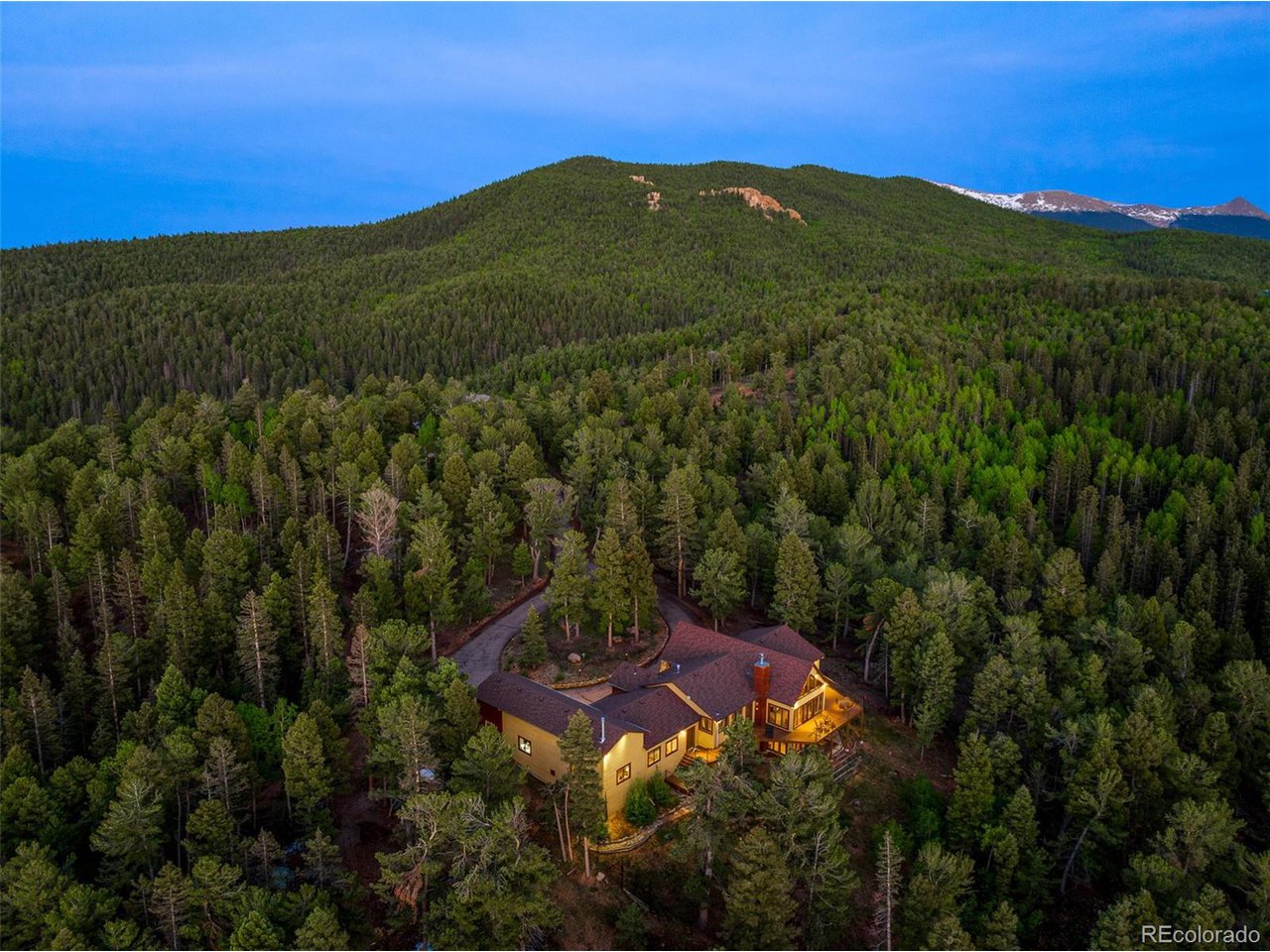 2755 Elk Ridge Divide Divide, CO 80814 - Photo 50 of 50 Aerial view of the back of the home at dusk