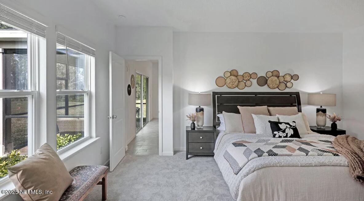 36 Bluegrass Way St. Augustine, FL 32092 - Photo 22 of 40 a bedroom with a bed and a window