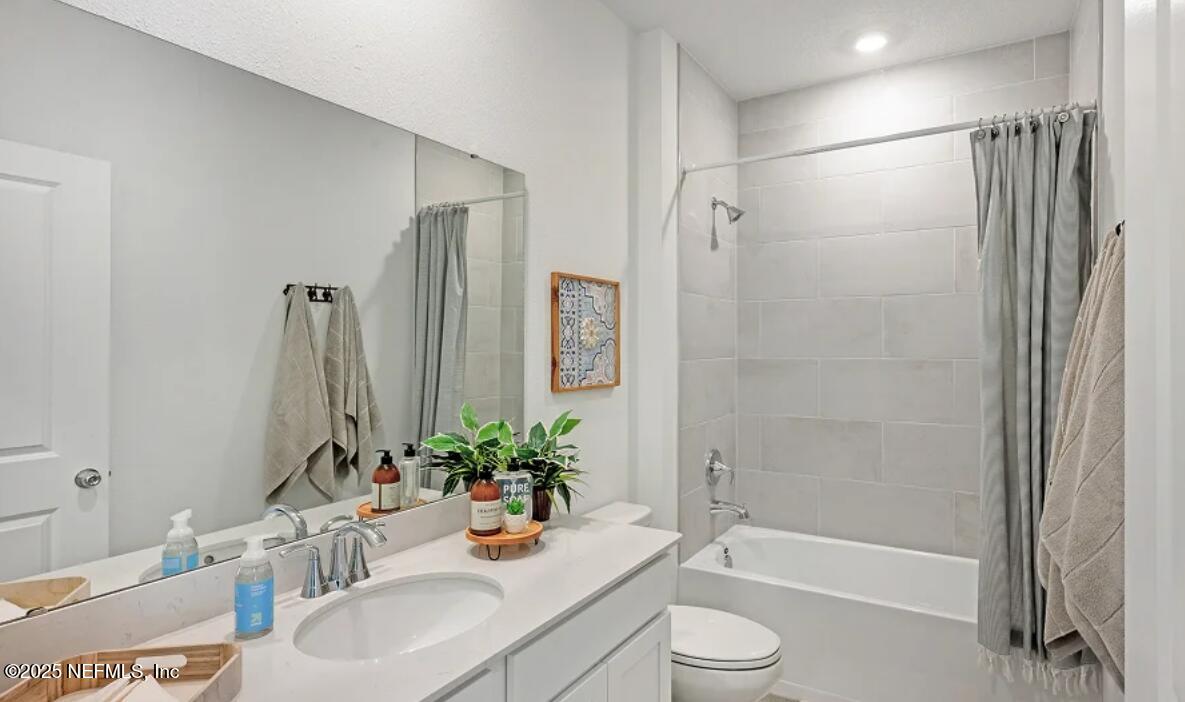 36 Bluegrass Way St. Augustine, FL 32092 - Photo 4 of 40 a bathroom with a sink a toilet and shower