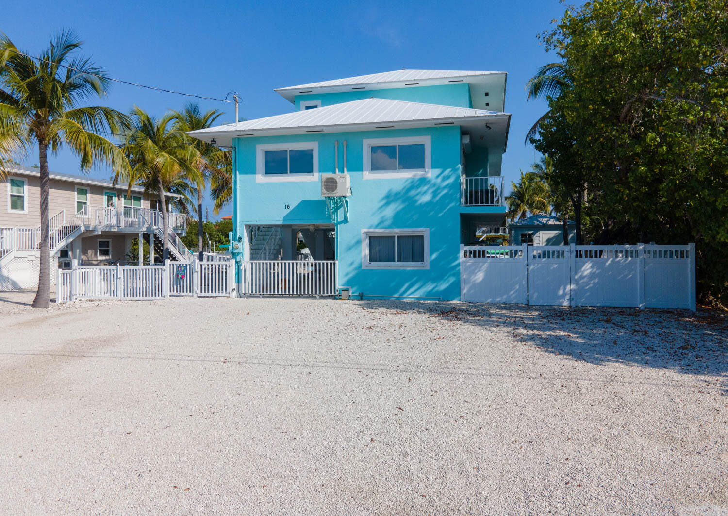 16 Corrine Place Key Largo, FL 33037 - Photo 1 of 50 a front view of a house with a yard