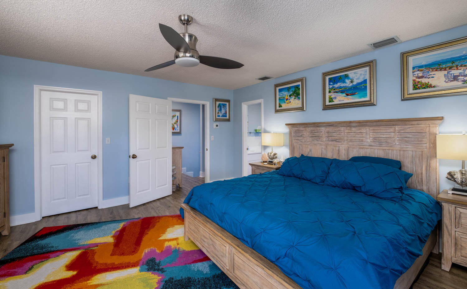 16 Corrine Place Key Largo, FL 33037 - Photo 20 of 50 a bedroom with a bed and a fireplace
