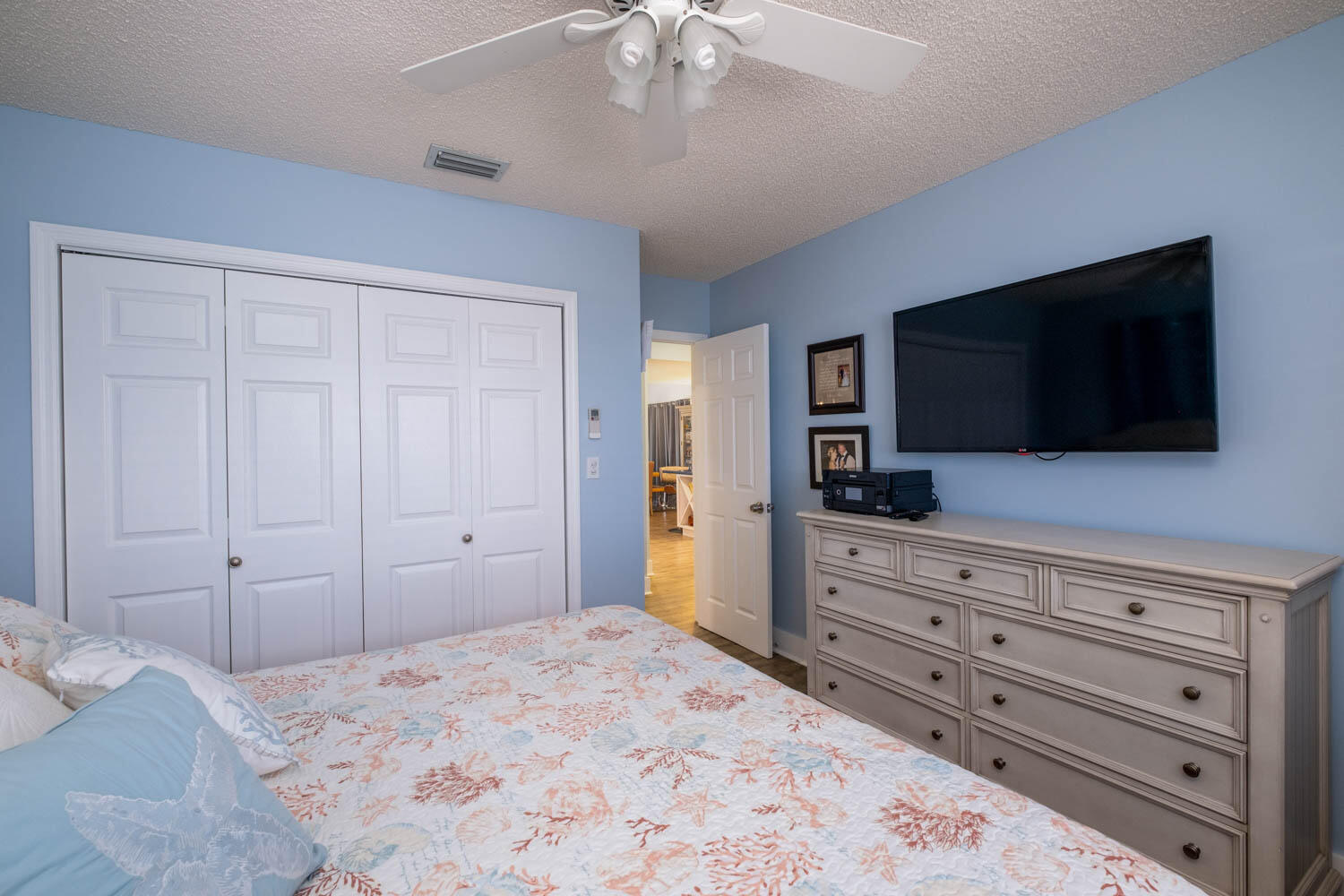 16 Corrine Place Key Largo, FL 33037 - Photo 28 of 50 a bedroom with a bed and a flat screen tv in white walls