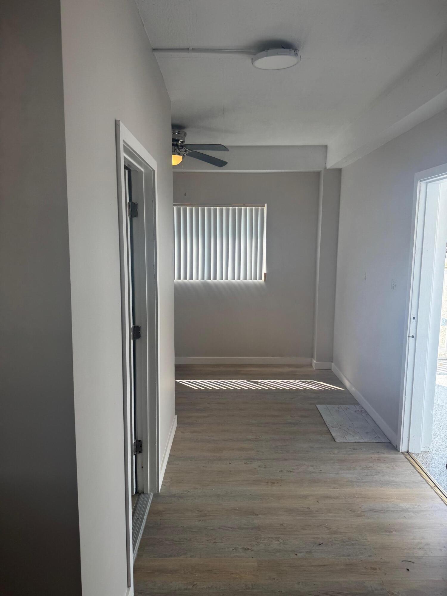 16 Corrine Place Key Largo, FL 33037 - Photo 32 of 50 a view of an empty room with wooden floor and a window
