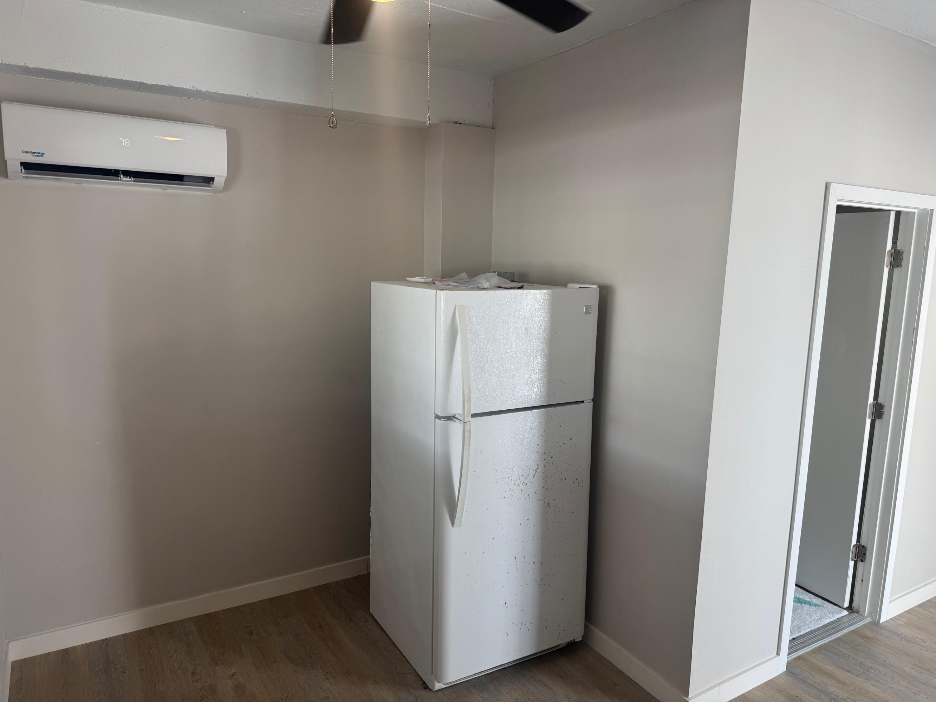 16 Corrine Place Key Largo, FL 33037 - Photo 34 of 50 a white refrigerator freezer sitting in a kitchen