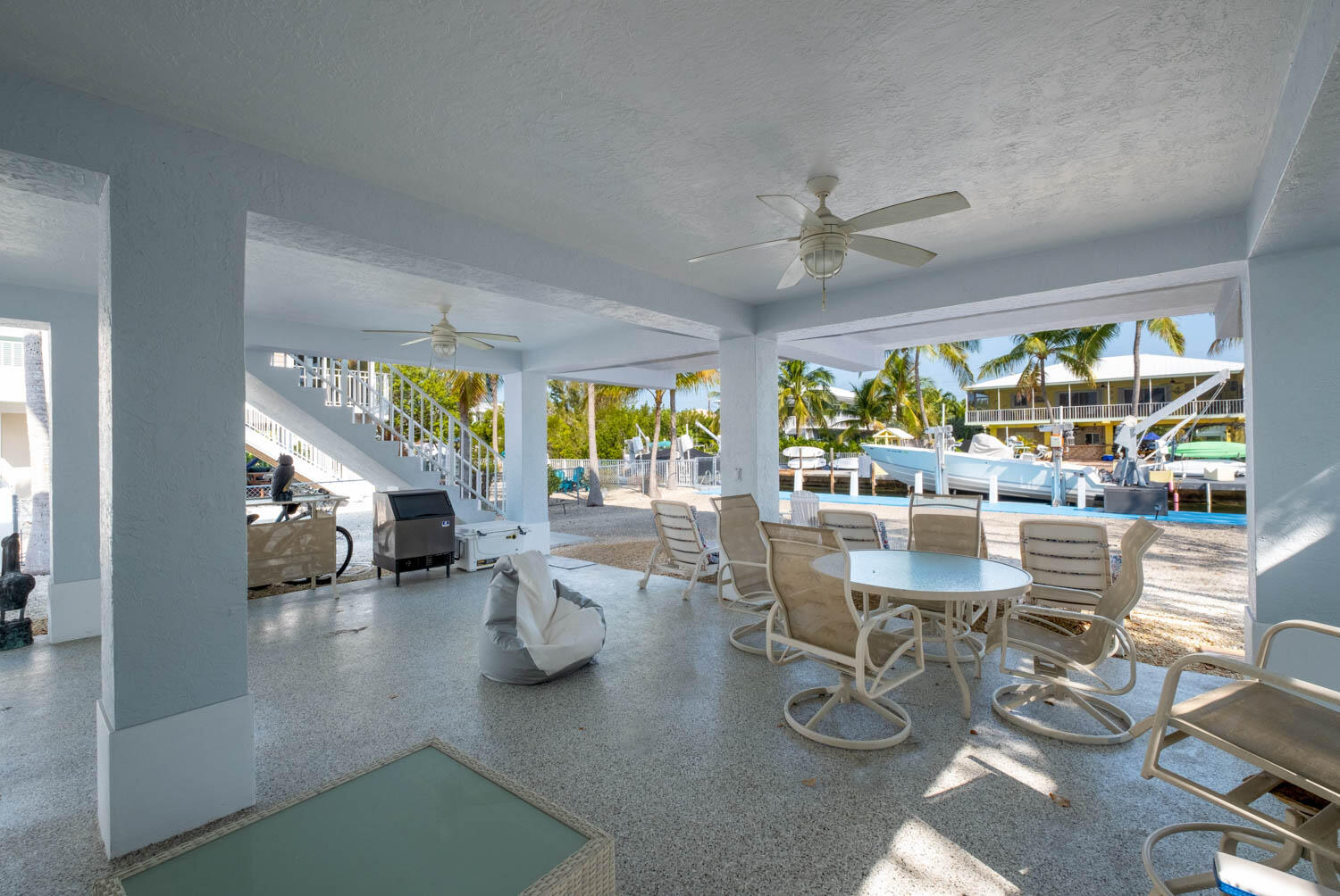 16 Corrine Place Key Largo, FL 33037 - Photo 8 of 50 a living room with couches and a dining table with large kitchen view