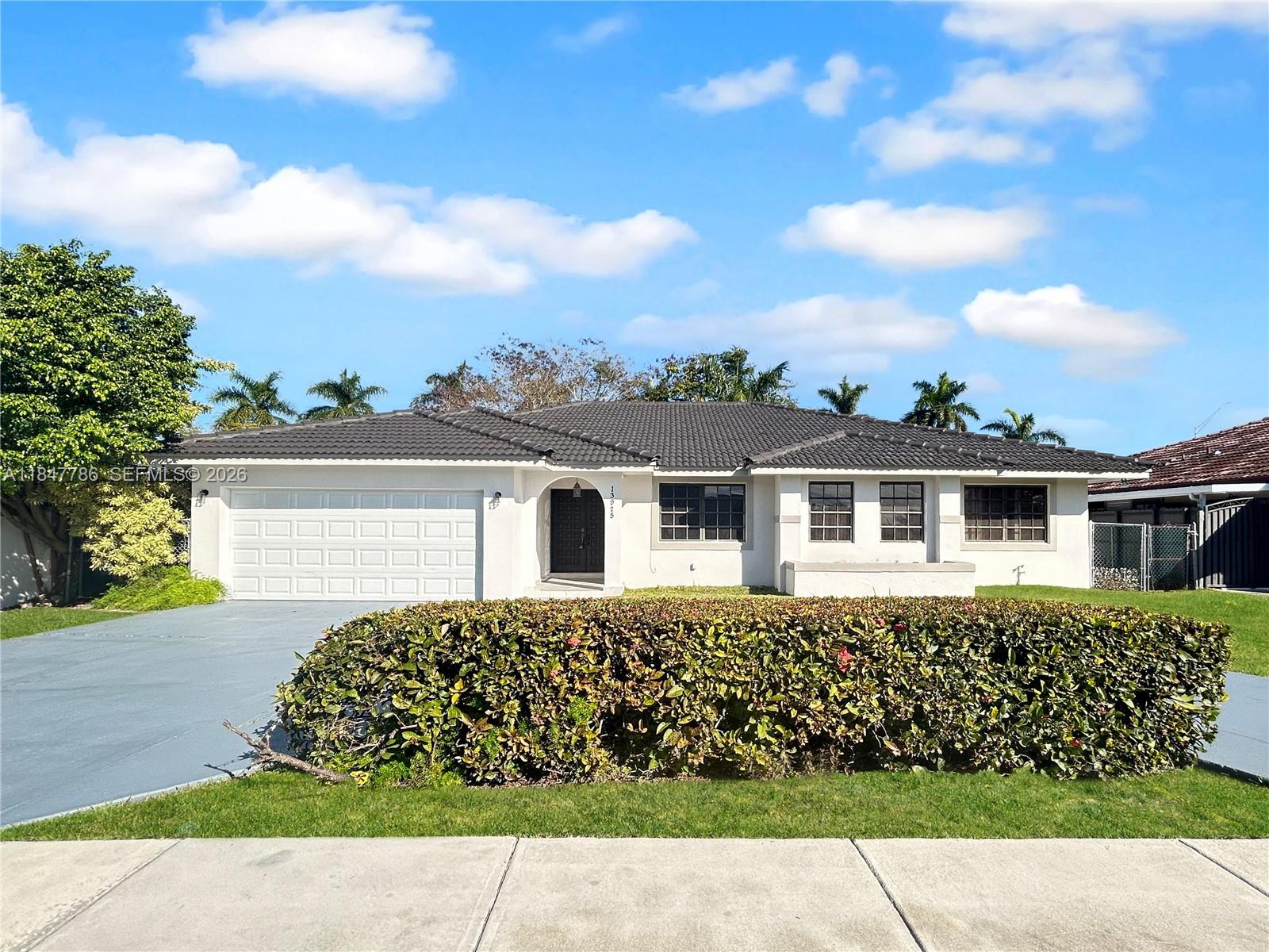 13925 Southwest 26th Terrace Miami, FL 33175 - Photo 1 of 42 front view of house with a yard