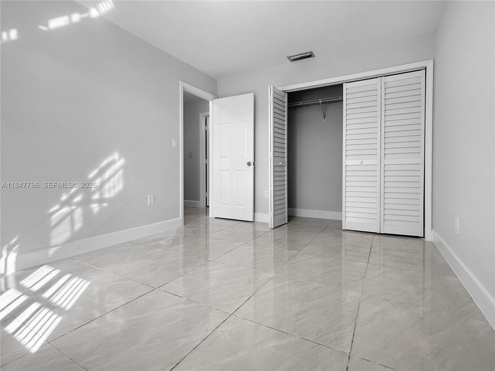 13925 Southwest 26th Terrace Miami, FL 33175 - Photo 15 of 42 a view of a room with a projector and stairs