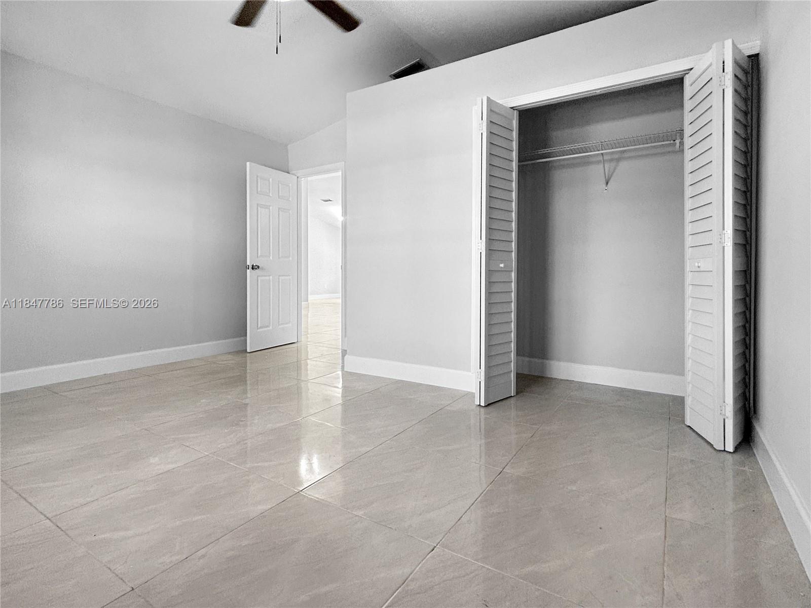 13925 Southwest 26th Terrace Miami, FL 33175 - Photo 16 of 42 an empty room with a empty space and windows