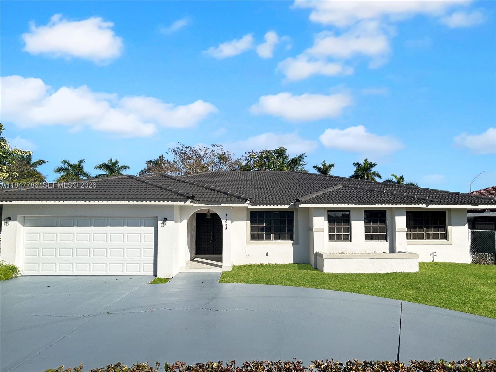 13925 Southwest 26th Terrace Miami, FL 33175 - Photo 2 of 42 front view of a house and a yard