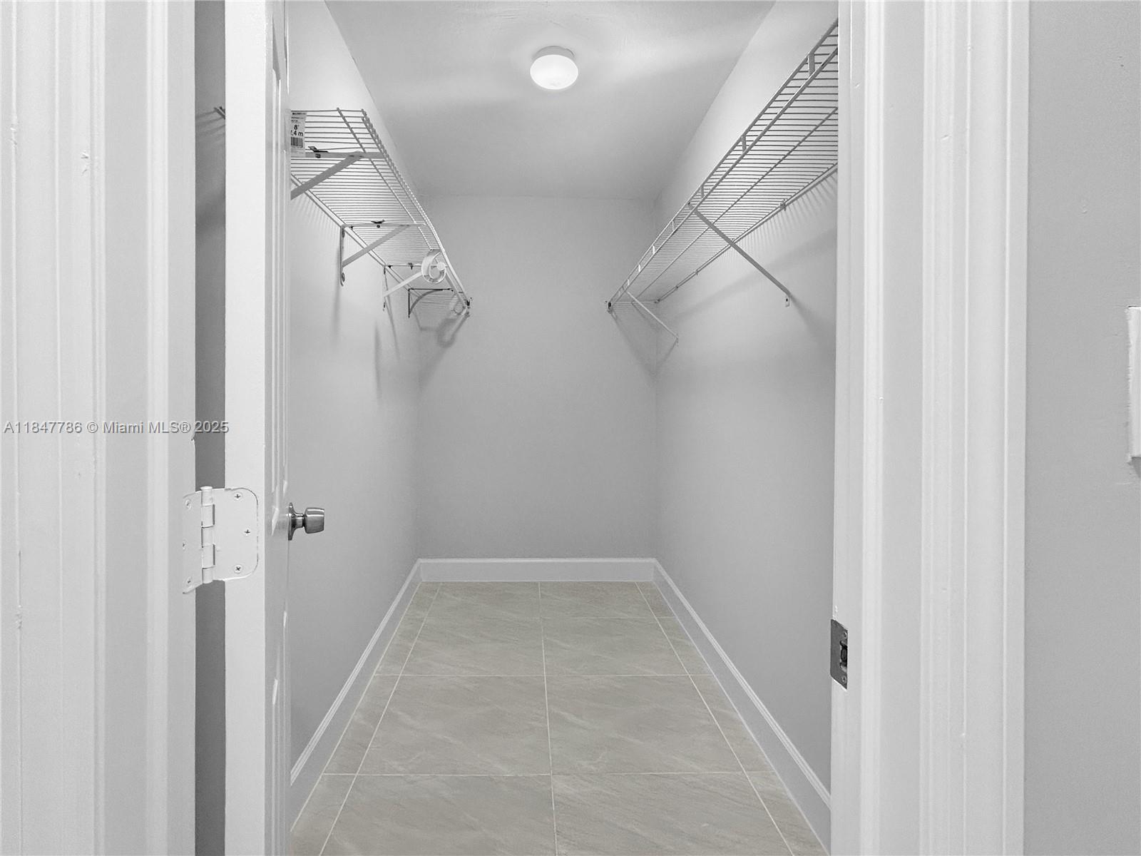 13925 Southwest 26th Terrace Miami, FL 33175 - Photo 22 of 36 a view of a room with rack on the wall