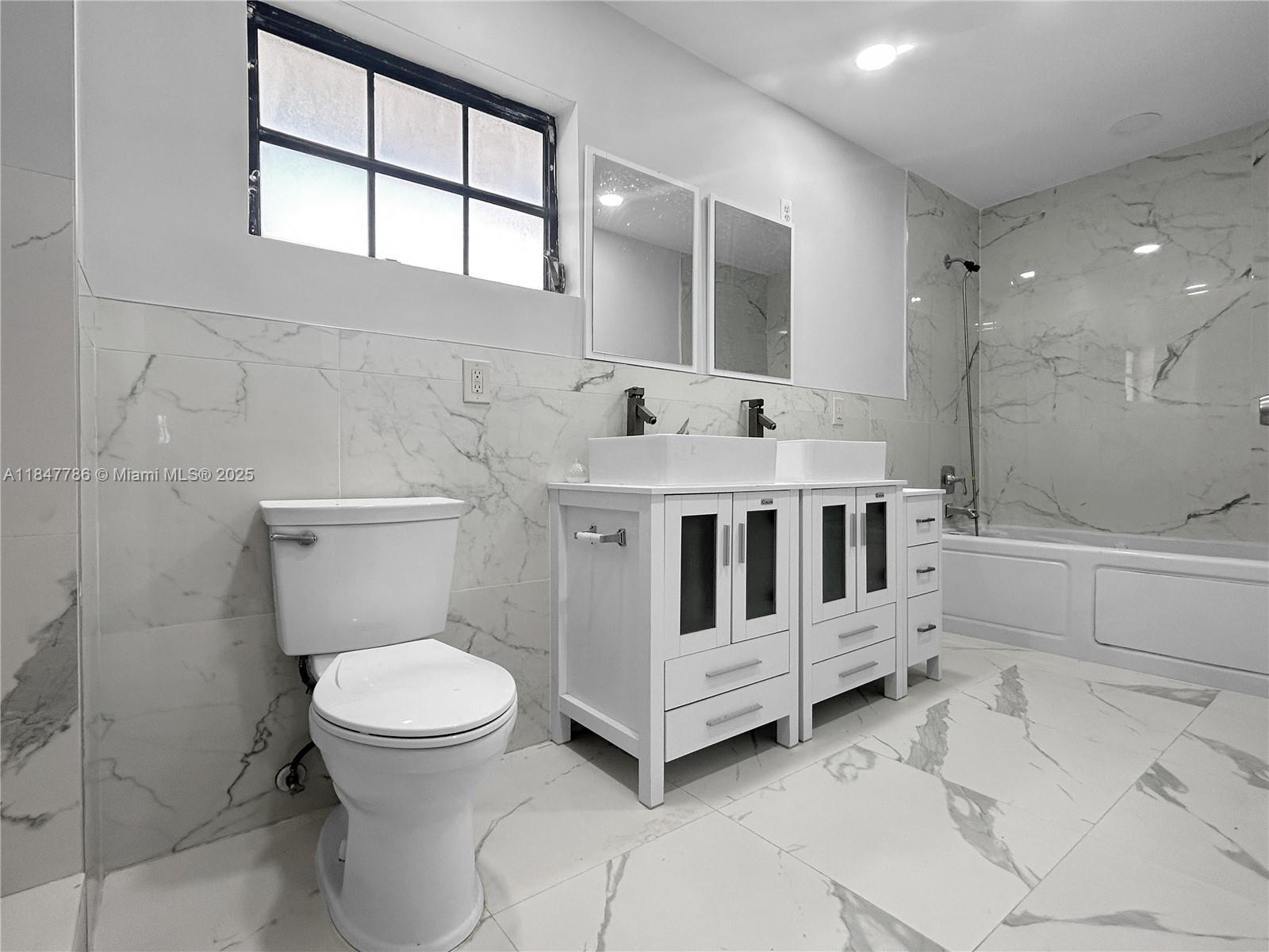 13925 Southwest 26th Terrace Miami, FL 33175 - Photo 23 of 36 a white sink sitting next to a white toilet