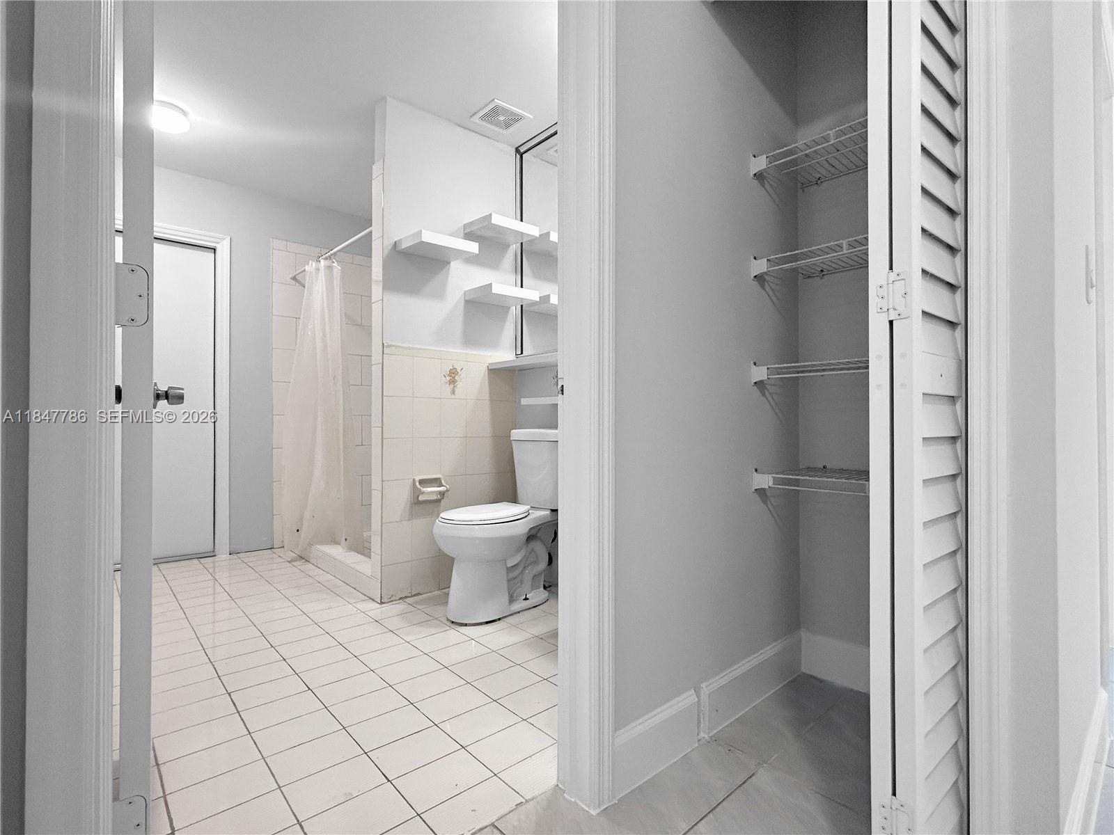 13925 Southwest 26th Terrace Miami, FL 33175 - Photo 24 of 42 a bathroom with a toilet and a shower