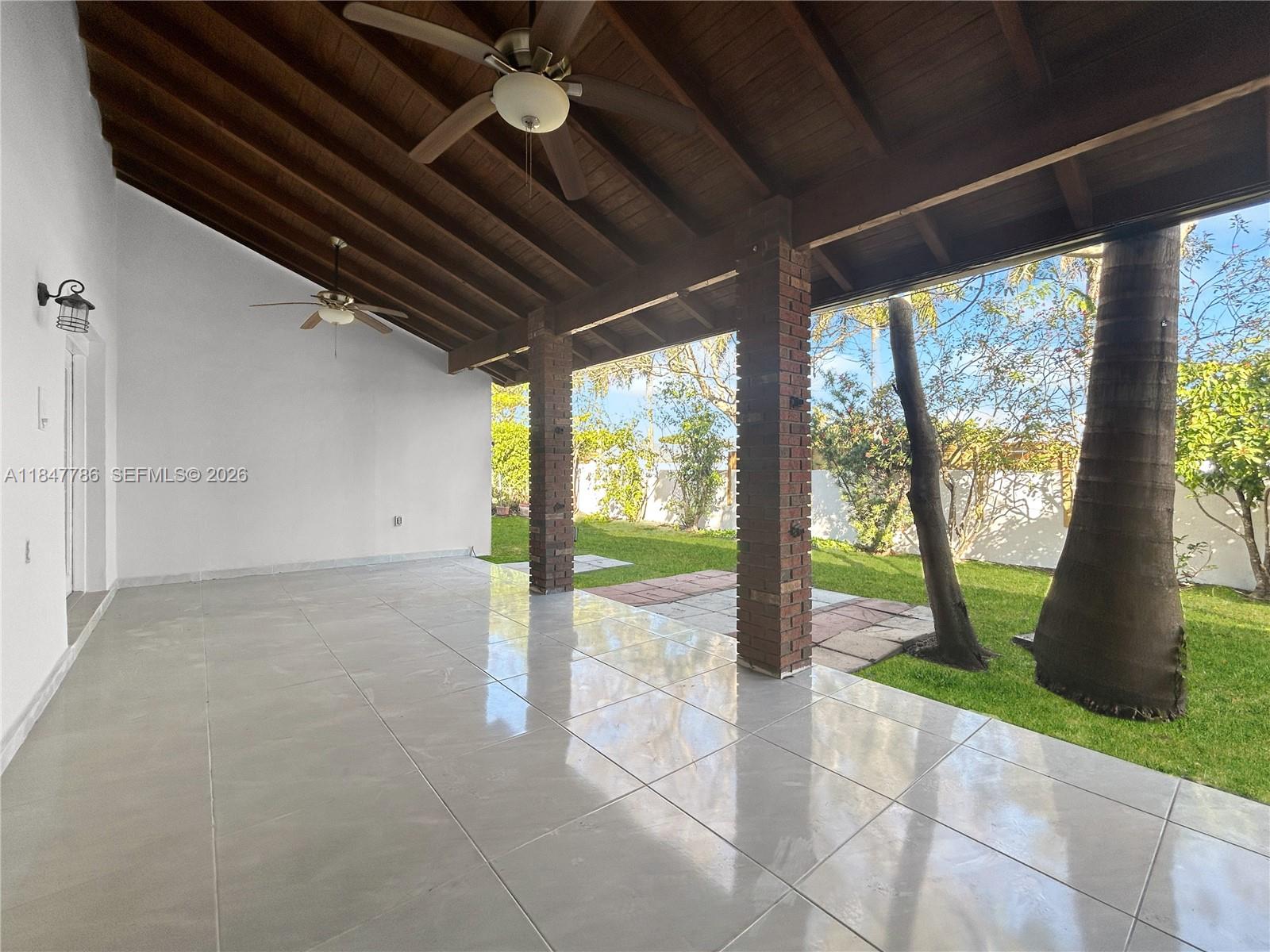 13925 Southwest 26th Terrace Miami, FL 33175 - Photo 34 of 42 a view of an empty room with a large window